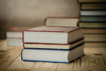 Textbooks and books on a wooden table