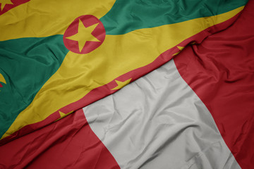 waving colorful flag of peru and national flag of grenada.