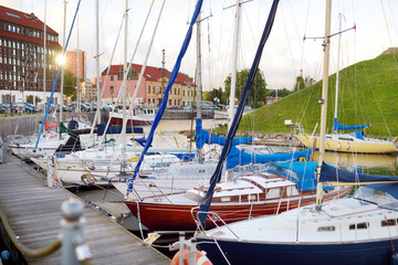 Beautiful yachts by the pier in the yacht club in Klaipeda, Lithuania.