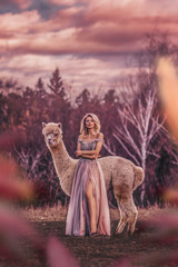 Beautiful woman with alpaca photoshoot
