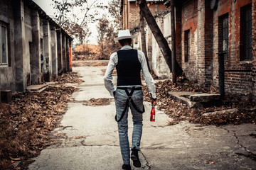 Rear view of retro-styled man walking on the street.