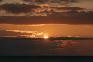 Fototapeta premium Cosmic cloudy sunset on the baltic sea