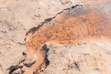 The beginning of the educated red streamlet taking from large lake.