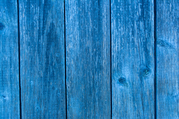 A fragment of a old plank wall. Blue wood texture background