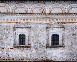 Fototapeta na wymiar Old brick facade of the abandoned church with tradition russian religious architectural details