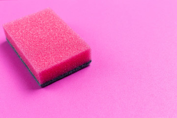 Obraz na płótnie Canvas Pink cleaning sponge on a pink background