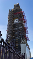 Fototapeta na wymiar panorama of big ben under construction work on a sunny day, London, UK