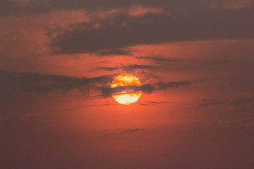 The sunset was cut by the clouds.