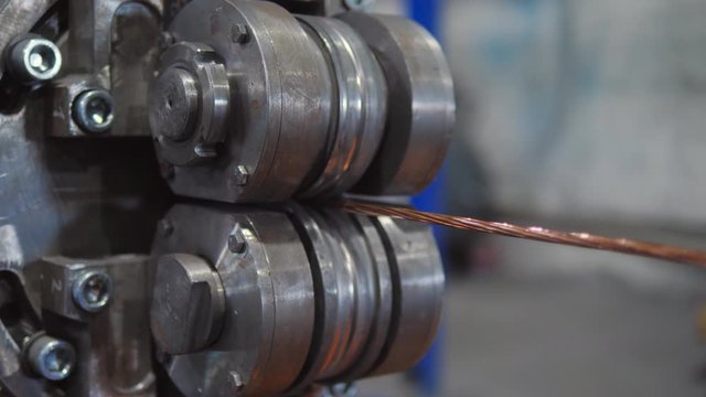 The manufacturing process of electrical cable made from copper wire. Clouce-up plan drawn copper wire.