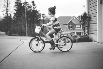 Fototapeta na wymiar Girl Riding Bike 