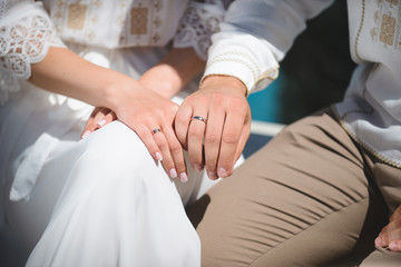 newlyweds demonstrating rings