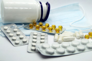 blisters with pills, medicine jar, medical mask