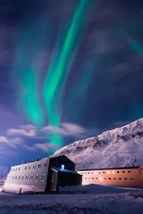 Poster The polar arctic Northern lights aurora borealis sky star in Norway Svalbard in Longyearbyen  with the  mountains. Travel adventure © bublik_polina