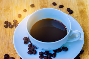 Black coffee on the wooden floor  Morning drink. Top view