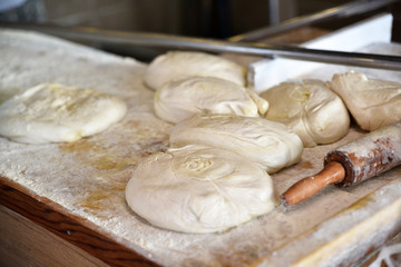 preparing dough balls for baking