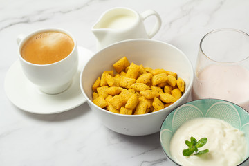 black coffee, cereal, milk and yogurt close-up