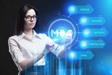 Business, Technology, Internet and network concept. Young businessman working on a virtual screen of the future and sees the inscription: MBA