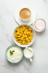 black coffee, cereal, milk and yogurt 