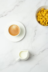 cereal, cup of black coffee and milk top view