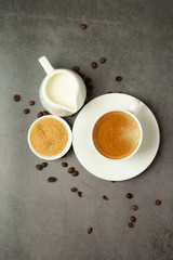 cup of coffee with whipped cream on a black background