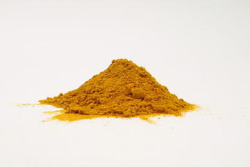 Turmeric extract powder on a white background is used as a tonic for the body and food ingredients.