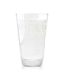 Glass of water with lemon slices in close-up on a white background. Isolated