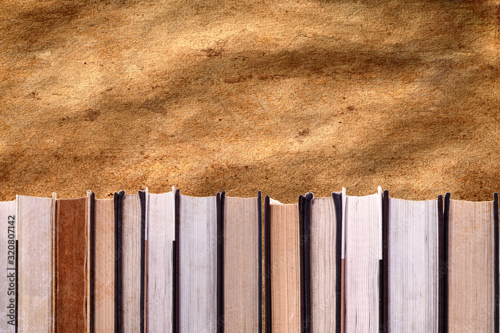 Aufkleber a stack of books. on the background of old paper. template for designer
