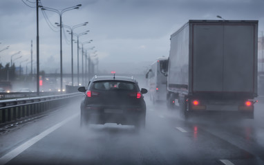 Fototapeta na wymiar Driving on a wet highway