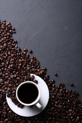 Coffee cup and beans on old grey kitchen beton , rock table. Top view with copyspace for your text