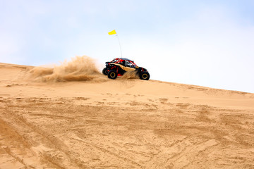 Off-road vehicle traveling in the desert © zhengzaishanchu