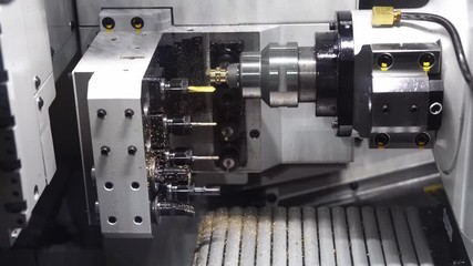 The swiss type CNC lathe machine making the brass connector parts for air-condition parts. The hi-technology metal working processing by multi-tasking CNC turning machine - Powered by Adobe