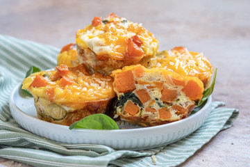 Delicious egg muffins with sweet potato, spinach and onion