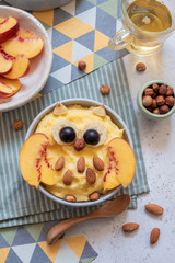 Kids breakfast polenta porridge with fruit look like a cute owl