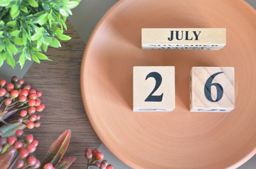 July 26, month design with flower and earthenware.