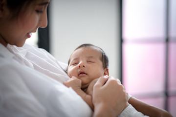 The baby is sleeping on a soft mattress