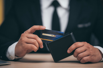 Business people use credit cards to do financial transactions at work