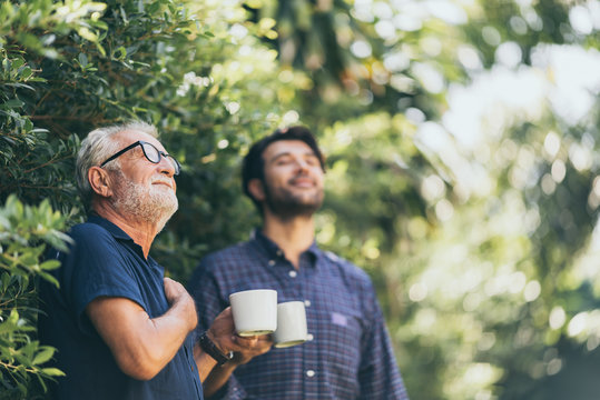 Old Father And Son, Morning Coffee In A Garden