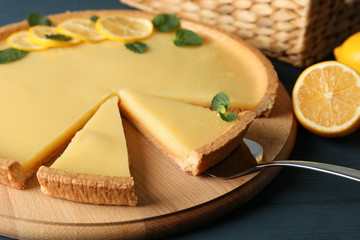 Composition with lemon tart on wooden background, close up