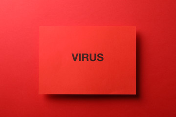 Inscription Virus on red background, top view. Healthcare and medical concept