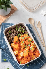 Tofu and sweet potato curry with lentils in lunch box