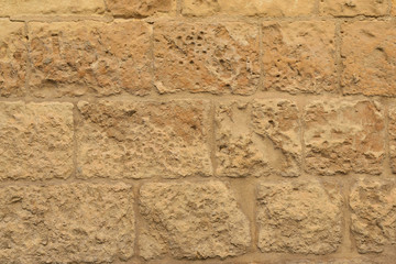 Limestone wall of a traditional medieval Maltese house Lija village, Malta, background, texture - 320813750