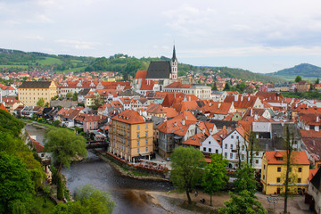 Fototapeta na wymiar Aerial view of the traditional colorful houses of Cesky Krumlov and Vltava river, in Czech Republic