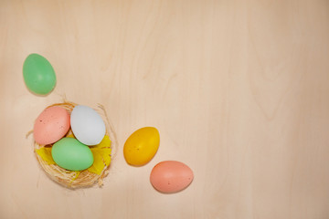 Colorful easter eggs on wooden background