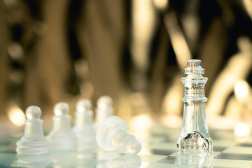 Chess board game made of glass, business competitive concept