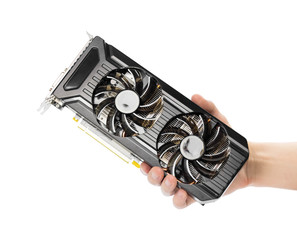 The hand holds a powerful video card with two fans. Close up. Isolated on a white background