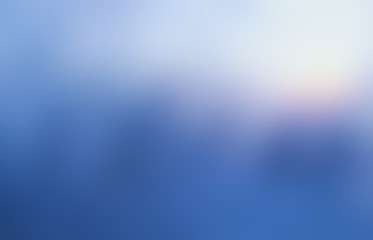 Frosty window abstract blurred texture. Empty blue background. Defocus view winter illustration.