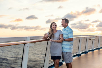 Middle aged couple enjoying a Caribbean Cruise vacation together. Candid photo of a couple holding...