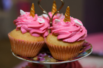 Muffin with pink cream. Culinary sweet Cakes curly cookies.