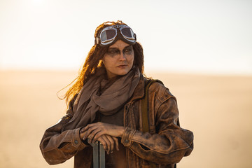 Armed Post-apocalyptic Woman Outdoors in a Wasteland