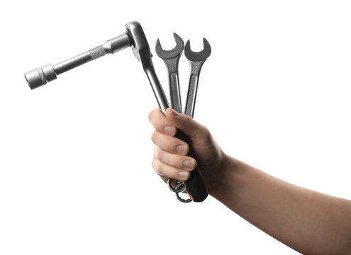 Auto mechanic holding different wrenches isolated on white, closeup